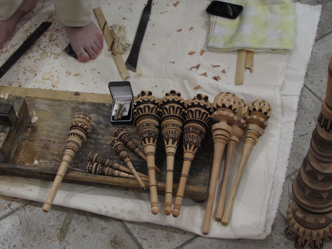Hand-carved wooden molinillo whisks for frothing chocolate in Oaxaca