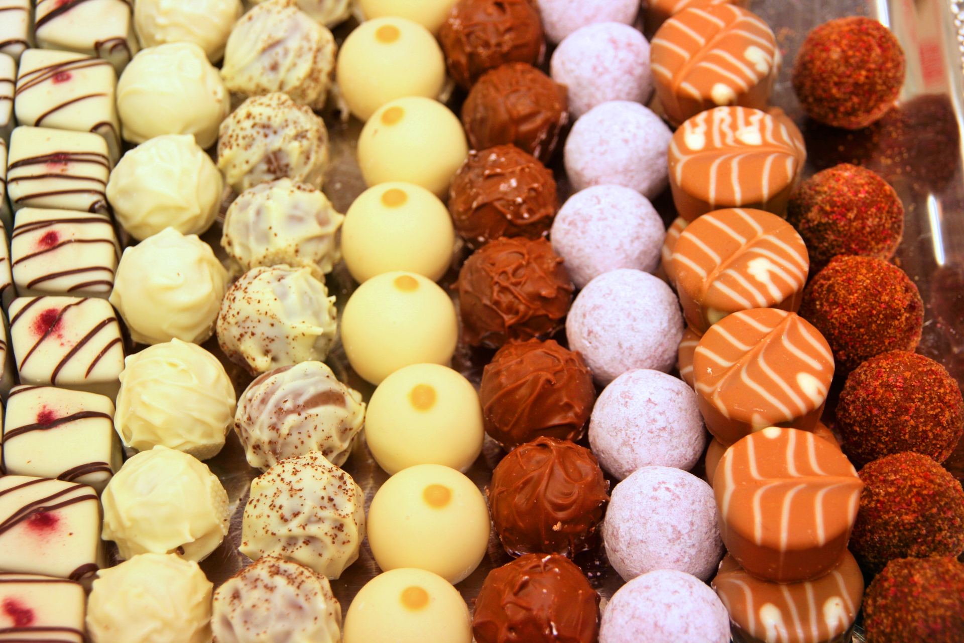Rows of assorted chocolate pralines and truffles in a Vienna shop